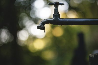 Water dripping from pipe fitting